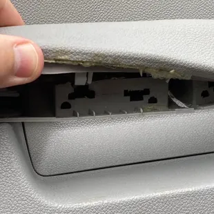 Clearly broken, but undisclosed door pull break. Can't replace small part. Have to replace COMPLETE door panel. $450+++.