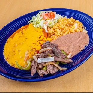 SAs Favorite! Beef fajitas and two enchiladas.