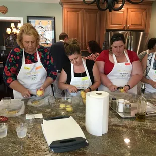 Large class peeling potatoes for fluffy Herb Mashed Potatoes