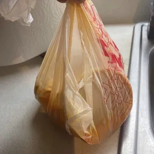 a person holding a plastic bag