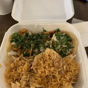 a take out container of mexican food