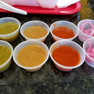 Salsa verde, medium roasted, and hot salsa + side of pickled onions