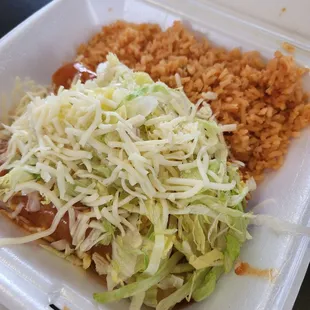 a take out container with rice and beans