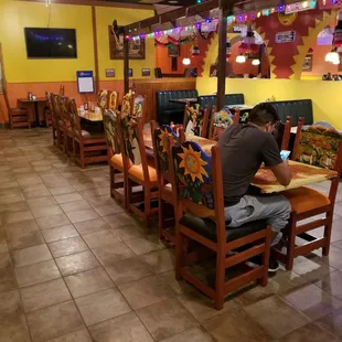 a man sitting at a table in a restaurant