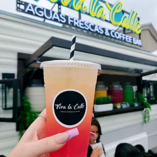 a person holding a drink