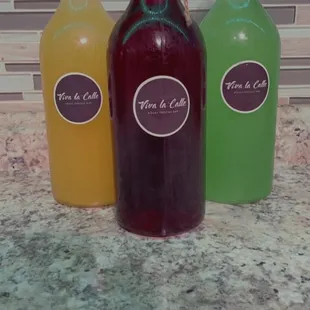 three bottles of juice