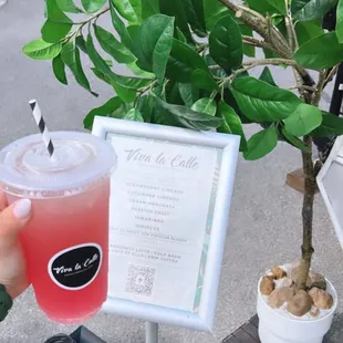 a person holding a drink