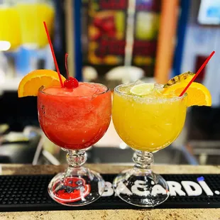 two cocktails on a bar