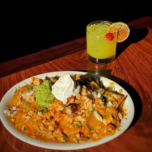 Pollo Asado Nachos with a refreshing premium lime tequila cocktail
