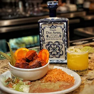 Our delicious Carnitas de Puerco Pibil and organic passion fruit margarita