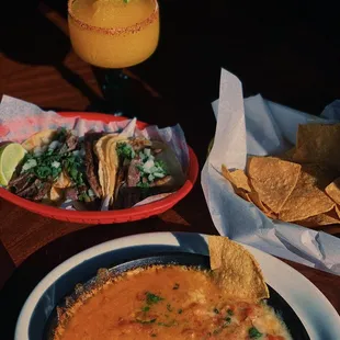 Happy Hour food which is available only at the bar including queso fondue and street style tacos and much more. 3-7pm everyday!
