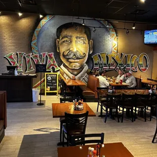 a mural of a mexican man in a restaurant
