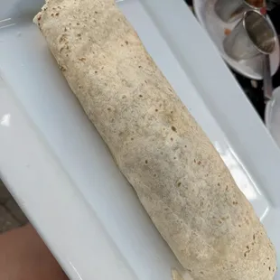 Huge California burrito - amazing steak cooked medium, French fries, cheddar cheese, and guacamole and pico de gallo. add hot sauce