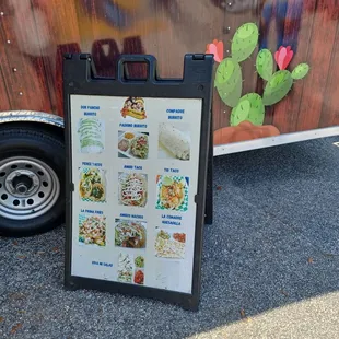 a food truck with a menu