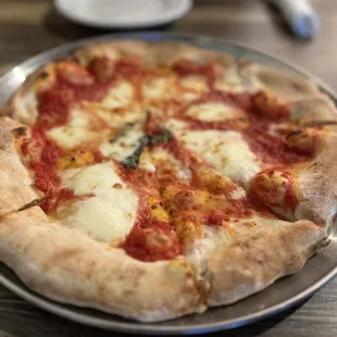 Margarita pizza. Not the best crust.