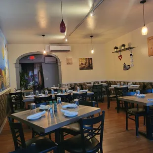 a dining room with tables and chairs