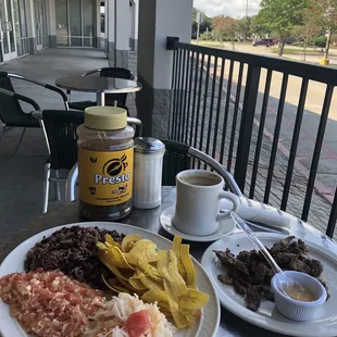 a plate of food and a cup of coffee