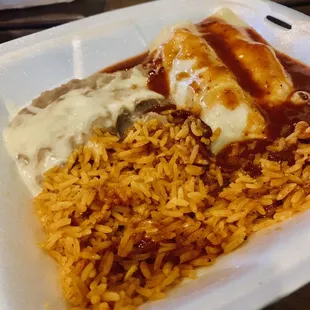 Enchiladas with rice (brown) and refried beans