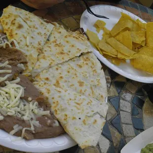 Refried beans, quesadilla, chips and salsa.