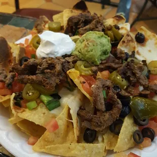 a plate of nachos on a table