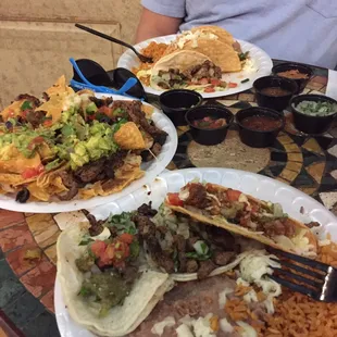 Steak tacos al carbon, shredded chicken crispy tacos, steak nachos