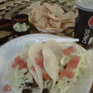 $5.95 for 3 steak tacos, chips and salsa/beans bar and a drink. Unbeatable and damn tasty!!!