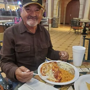 My grandpa enjoying his enchiladas.