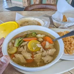 Caldo de pollo.  Large size, hand for scale.