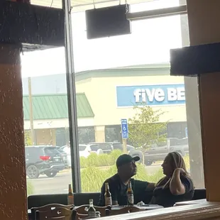 That's our waitress... she came over to take our order and then sat with this man for the rest of the time we were there. Unacceptable!