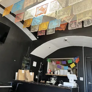mexican flags hanging from the ceiling