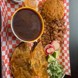 Quesobirria with consome, rice, and beans