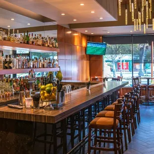 a view of a bar with lots of bottles