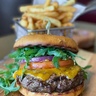 Vivel's Classic Burger:
Char-Grilled Beef patty, Grilled Onions &amp; Tomatoes, Cheddar cheese, Arugula, Brioche bun.