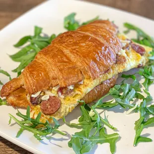 Breakfast Sandwich:
Scrambled Eggs, Merguez beef sausage, Mozzarella cheese. Arugula.