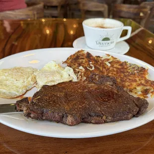 Breakfast steak and eggs with Chai tea latte. New York Steak and Eggs