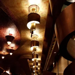 a row of lamps hanging from the ceiling