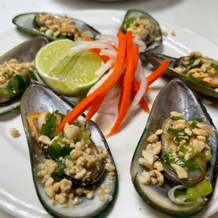 Grilled Mussels with butter, onion, and peanuts topping