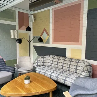 a living room with a couch, chair, and coffee table