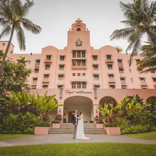 Bride and groom in front of the wedding venue.