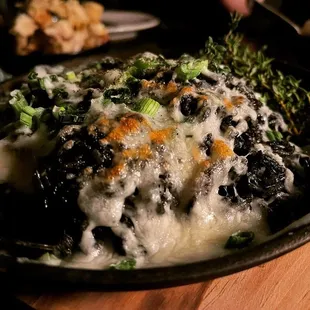 Squid ink rice with cheese