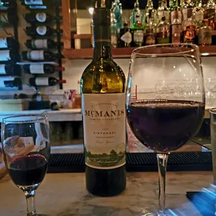 a glass of wine and a bottle of wine