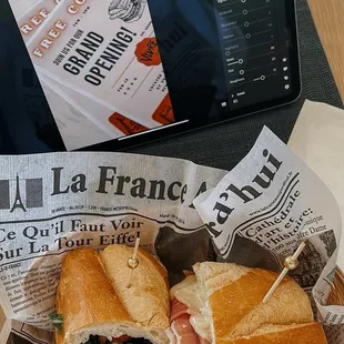 a sub sandwich and a laptop