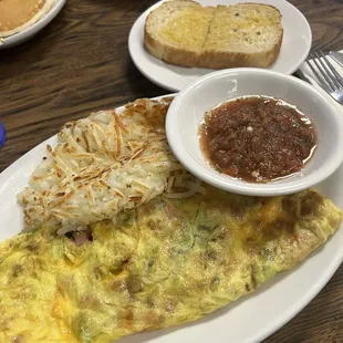 Denver omelette with fresh salsa, hash browns, and butter sourdough toast