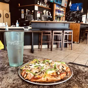 Lunch pizza (6.99), bar in background