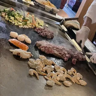 a chef preparing steaks