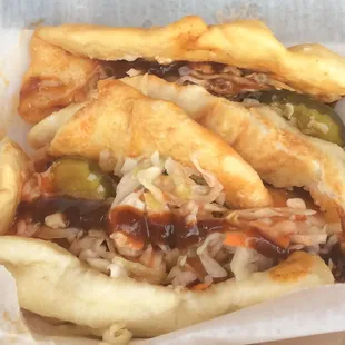 The pulled pork was wrapped in Langosh and loaded with spices, peppers and onions.