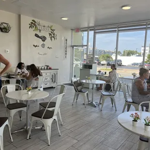 a woman standing in a coffee shop