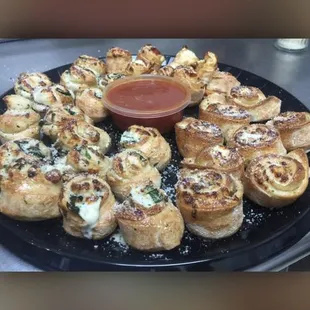 a plate of mini pizzas