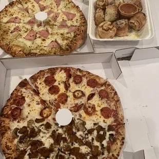 two pizzas in boxes