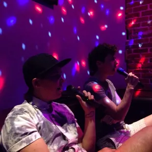 Queer karaoke singing Like a Virgin